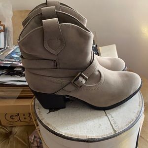 Unleashed tan booties with buckle and chunky heel.